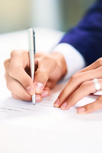 business-hands-and-writing-on-paperwork-in-office-2026-01-09-10-22-57-utc.jpg